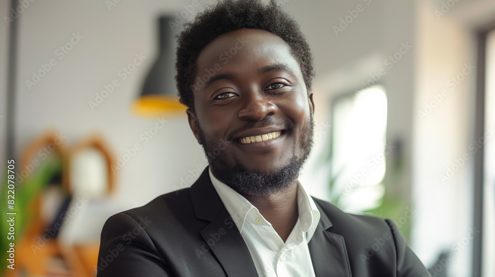 Confident African Man in Business Suit Smiling, Modern Office, Professional Atmosphere, Diverse Workforce, Bright Daylight, Urban Environment Confident African Man in Business Suit Smiling, Modern Office, Professional Atmosphere, Diverse Workforce, Bright Daylight, Urban Environment