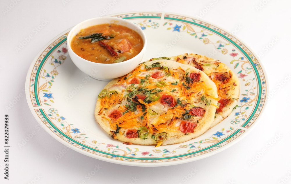 Masala Uttappam with sambhar, a south Indian healthy breakfast or teatime snack Masala Uttappam with sambhar, a south Indian healthy breakfast or teatime snack