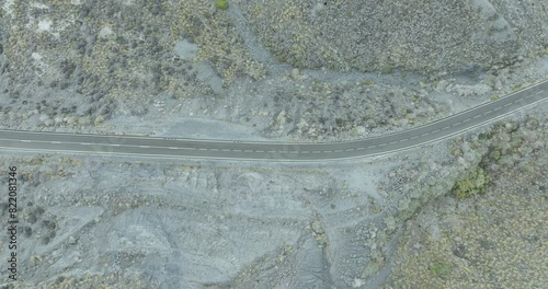 Aerial view of winding road through rocky desert terrain, Cala Concha, Cuevas del Almanzora, Andalusia, Spain. photo