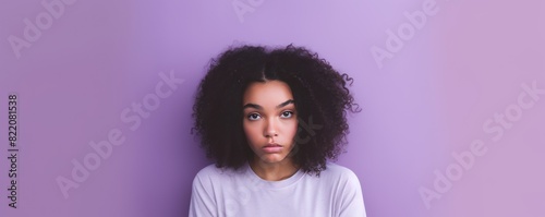 Lavender background sad black independent powerful Woman. Portrait of young beautiful bad mood expression girl Isolated on Background racism skin color depression anxiety