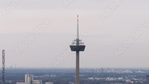 Colonius Turm Koeln telecommunication tower with Deutch Telecom logo aerial view in Cologne, Germany, cityscape background photo
