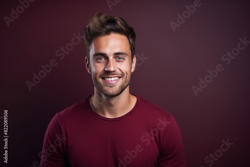 Maroon background Happy european white man realistic person portrait of young beautiful Smiling man good mood Isolated on Background Banner with copyspace blank empty copy space