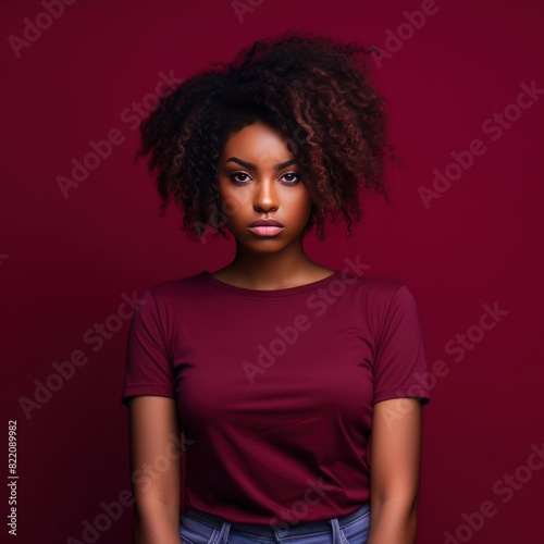 Maroon background sad black independent powerful Woman. Portrait of young beautiful bad mood expression girl Isolated on Background racism skin color depression  © Zickert