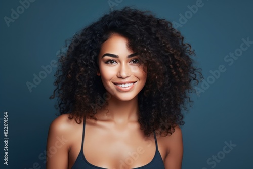 Navy background Happy black independant powerful Woman Portrait of young beautiful Smiling girl good mood Isolated on Background Skin Care Face Beauty 