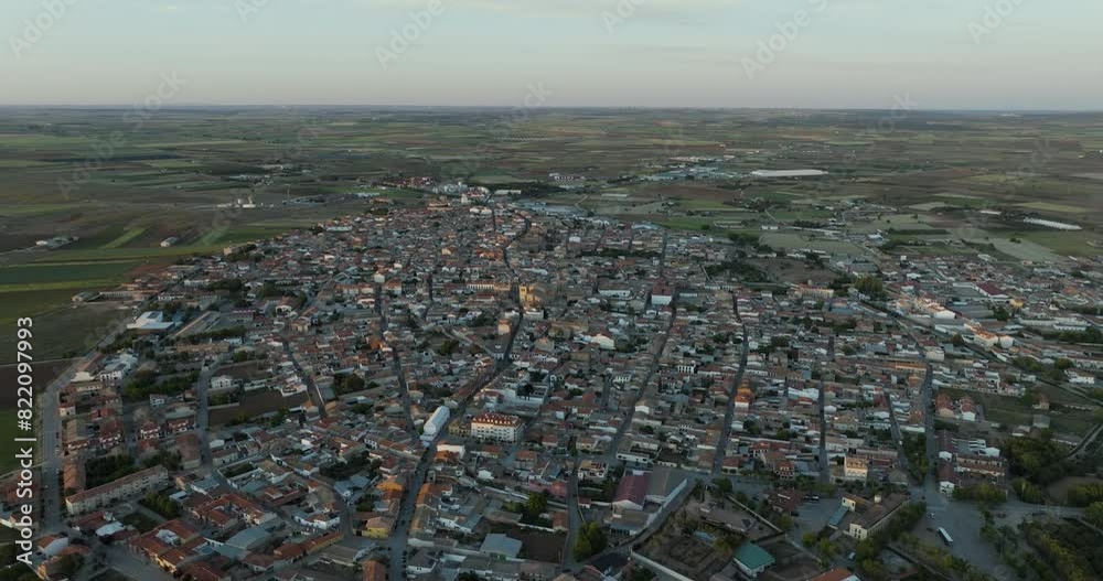 Aerial view of historic town with traditional rooftops and scenic sunset, San Clemente, Castilla - La Mancha, Spain.