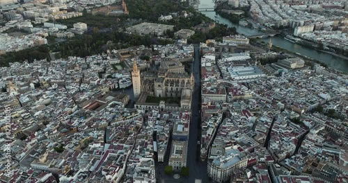 Aerial view of historic Seville Cathedral and Guadalquivir River, Seville, Spain.
