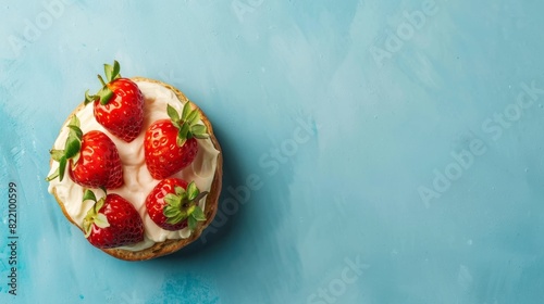 Loaf bread with strawberry fruit, cheese topping topping, multigrain, flat lay, copy space solid background photo