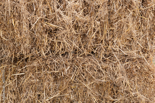 Dry haystack close-up background, straw texture. Dry straw, hay bales, close-up of the background photo