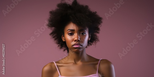 Pink background sad black independent powerful Woman. Portrait of young beautiful bad mood expression girl Isolated on Background racism skin color depression anxiety fear burn out 