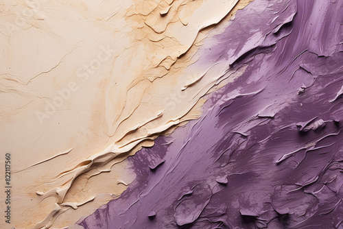 Showcasing a dynamic contrast between purple paint and beige texture, this image exemplifies artistic tension photo