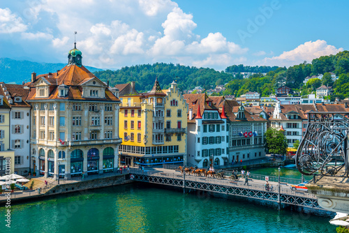 City of Lucerne with Bridge and Horse Parade in a Sunny Day in Switzerland. © Mats Silvan