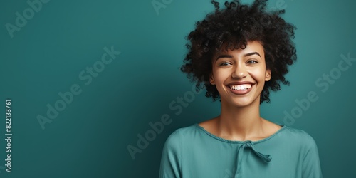 Teal background Happy black independant powerful Woman realistic person portrait of young beautiful Smiling girl Isolated on Background ethnic diversity equality acceptance concept with copyspace