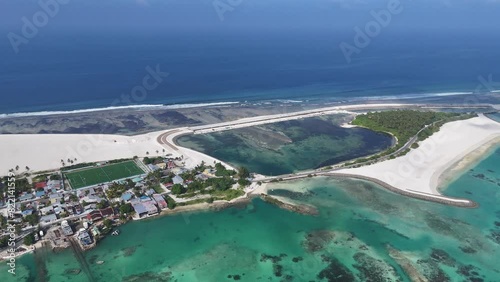 Aerial view of harbour, boats, houses, reclamation, Addu City Development Project, Maradhoo, Addu Atoll, Maldives. photo