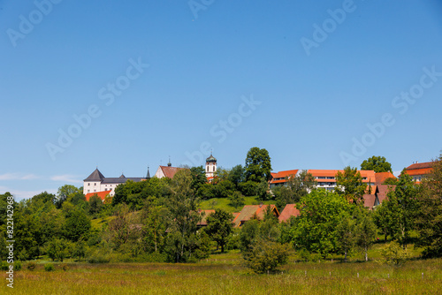 Wallpaper Mural View over blossoming fields in spring under a blue sky to the town and Wolfegg Castle Torontodigital.ca