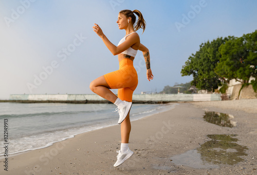 pretty young smiling woman doing sports in the morning in stylish sport outfit sportswear, skinny strong body, healthy fit lifestyle