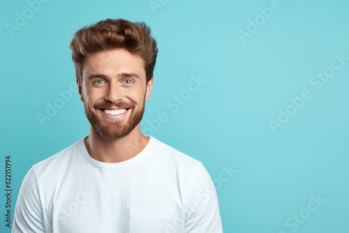 Turquoise background Happy european white man realistic person portrait of young beautiful Smiling man good mood Isolated on Background Banner with copyspace blank empty  © Zickert