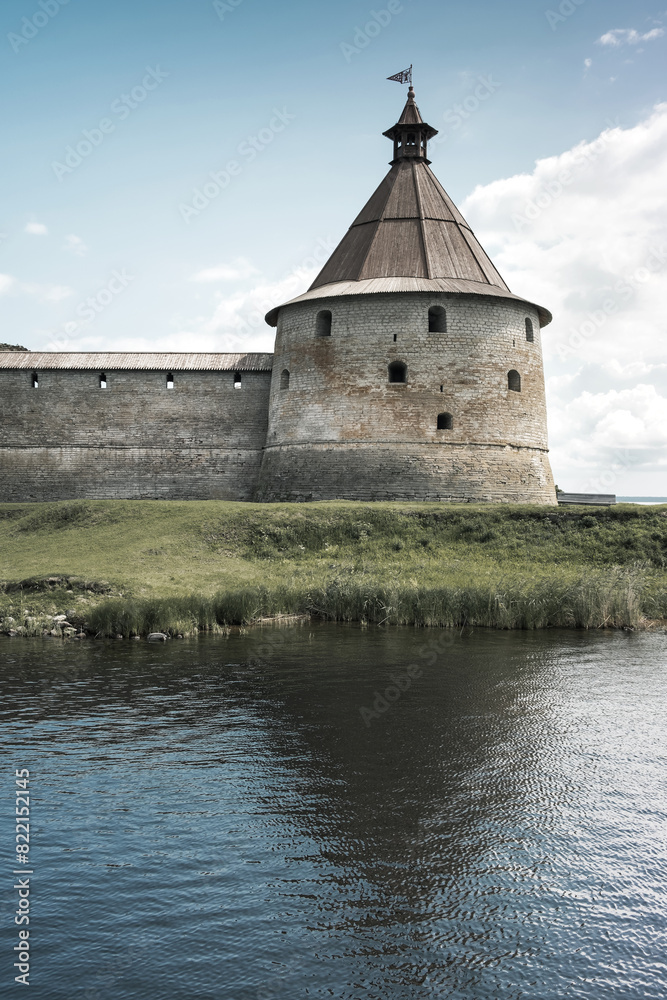 Watchtower, wall and fragment of a bastion in an ancient Russian fortress. Watchtower, wall and fragment of a bastion in an ancient Russian fortress.