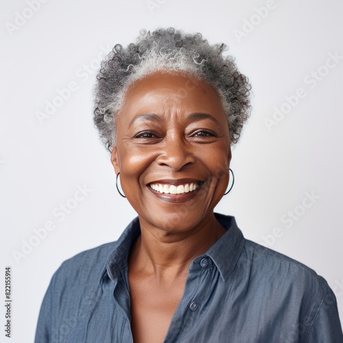 White Background Happy black american independant powerful Woman. Portrait of older mid aged person beautiful Smiling girl Isolated on Background ethnic diversity equality  © Zickert
