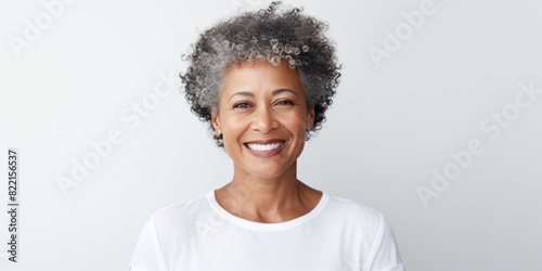 White Background Happy black american independant powerful Woman. Portrait of older mid aged person beautiful Smiling girl Isolated on Background ethnic diversity equality 