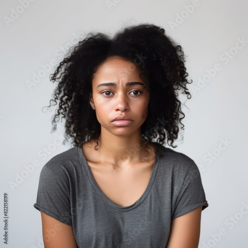 White background sad black independent powerful Woman. Portrait of young beautiful bad mood expression girl Isolated on Background racism skin color depression anxiety fear  © Zickert
