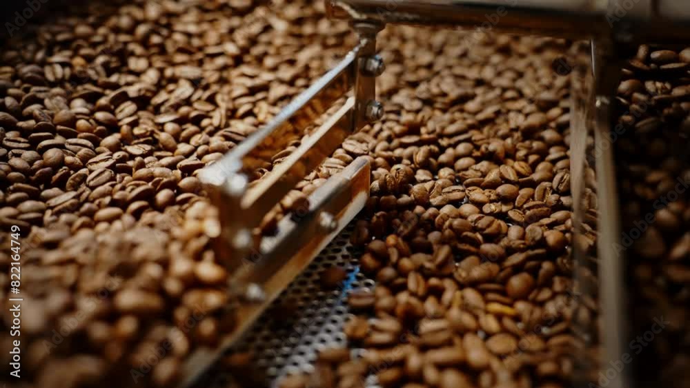 Close up of coffee beans in roaster Close up of coffee beans in roaster