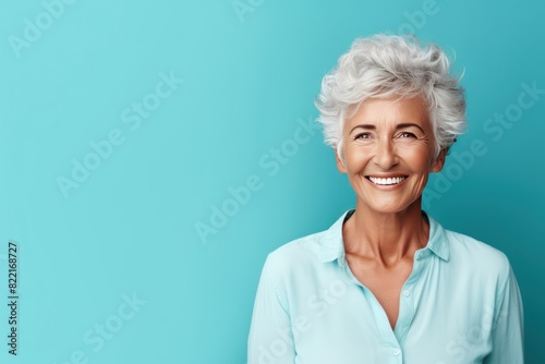 Aqua background Happy european white Woman grandmother realistic person portrait of young beautiful Smiling Woman Isolated on Background Banner with copyspace 