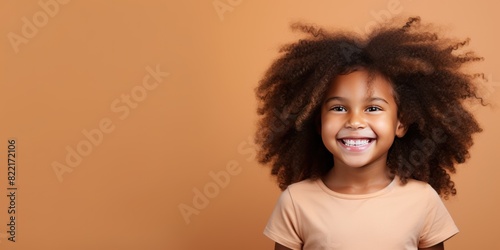Beige background Happy black american african child Portrait of young beautiful kid Isolated on Background ethnic diversity equality acceptance concept with copyspace