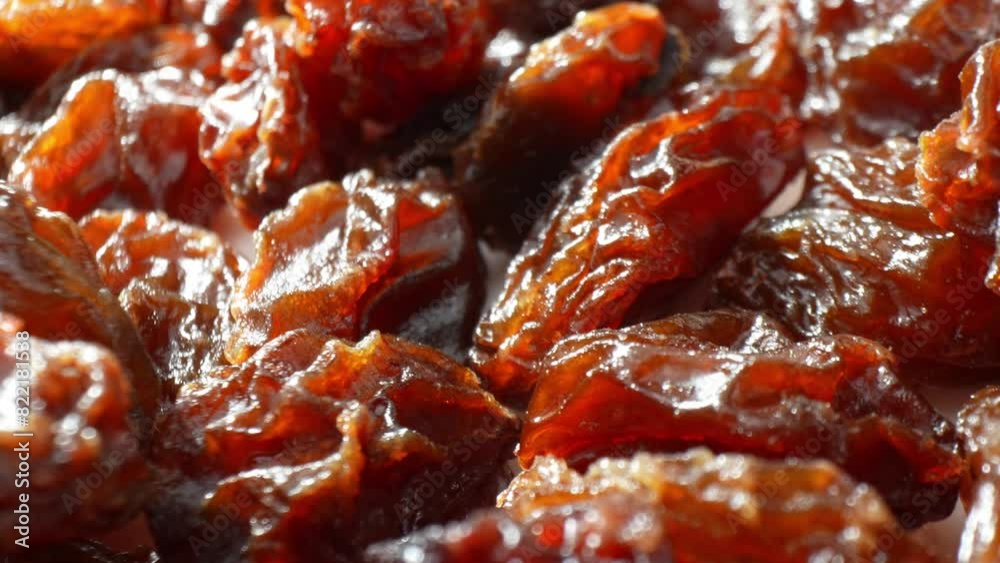 The black raisins, with their intricate creases and rich tones of dark brown, seem to dance in the light, radiating an aura of succulence and freshness.
The black raisins, with their intricate creases and rich tones of dark brown, seem to dance in the light, radiating an aura of succulence and freshness.