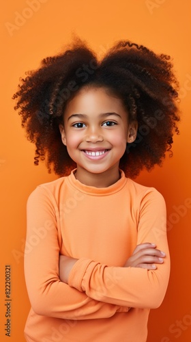 Coral background Happy black american african child Portrait of young beautiful kid Isolated on Background ethnic diversity equality acceptance concept with copyspace 