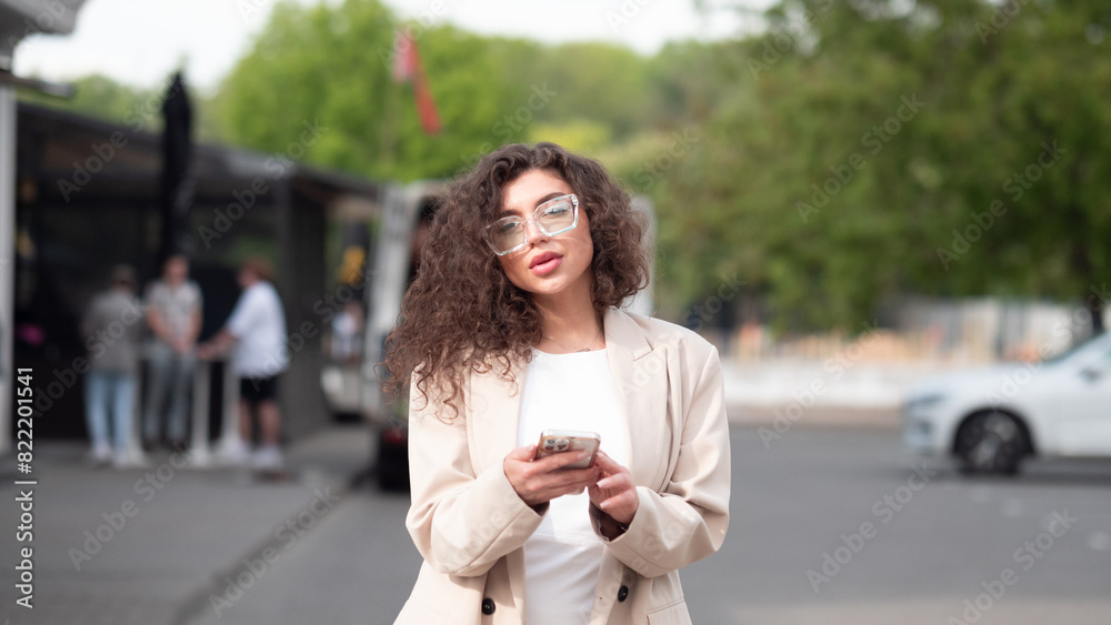 Business woman with phone in summer 