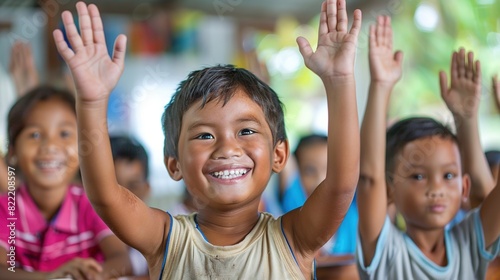 Young Children raising hands in class