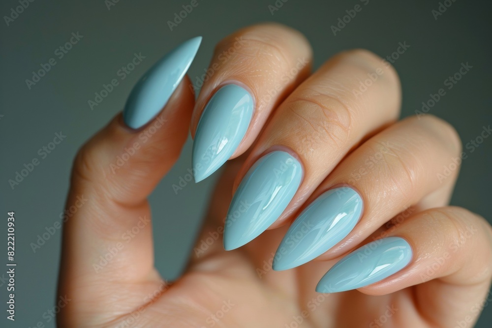 Hand Model With Long Almond Shaped Nails Painted In A Light Blue Color Nail Salon Hand Model With Long Almond Shaped Nails Painted In A Light Blue Color Nail Salon