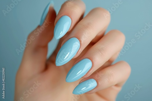 Hand Model With Long Almond Shaped Nails Painted In A Light Blue Color Nail Slaon