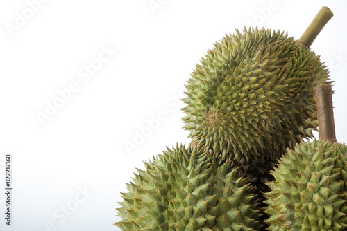 Close-up Photography Ripe durian, both pods and stalks, on isolated white background. © poomsak