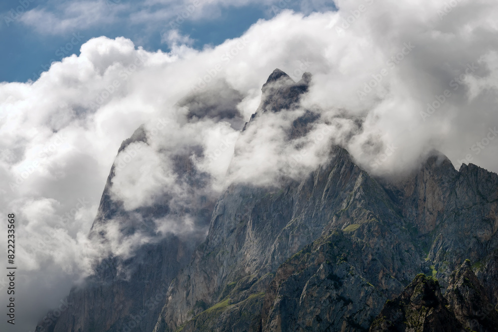 Clouds cover the peaks of the mountains. View of the Caucasus Mountains in Ingushetia, Russia