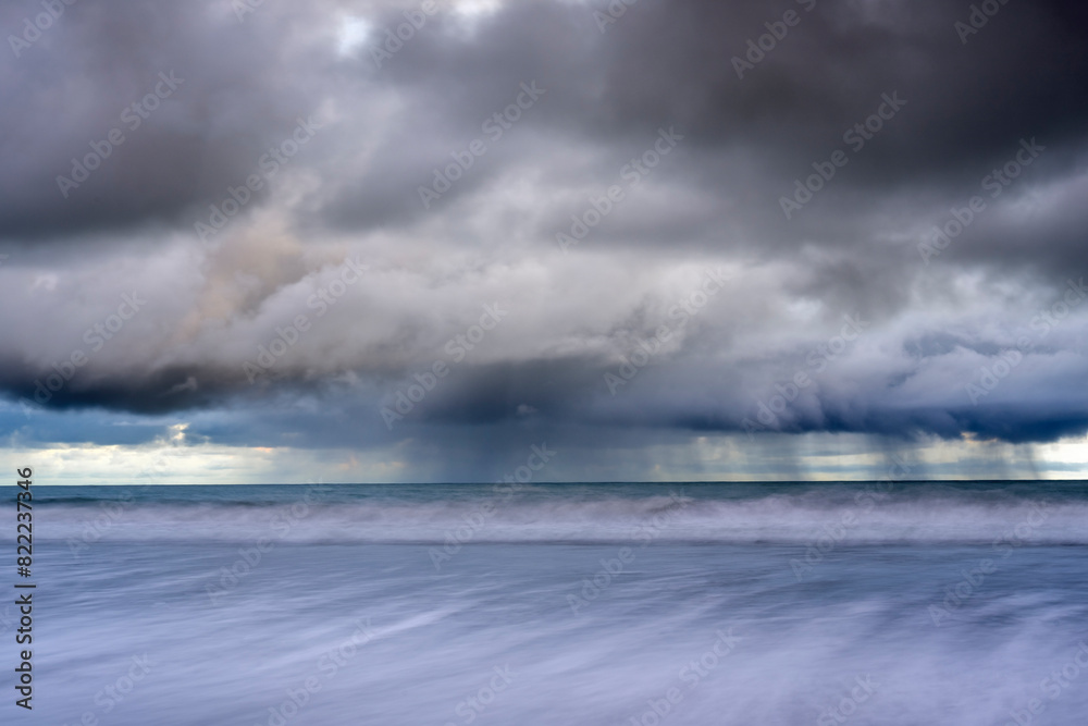 Storm clouds over the ocean viewed from Playa El Almejal, Bahia Solano, Choco, Colombia, Pacific Ocean. July, 2022. Storm clouds over the ocean viewed from Playa El Almejal, Bahia Solano, Choco, Colombia, Pacific Ocean. July, 2022.