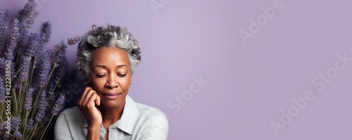 Lavender background sad black American independent powerful Woman. Portrait of older mid-aged person beautiful bad mood expression girl Isolated photo