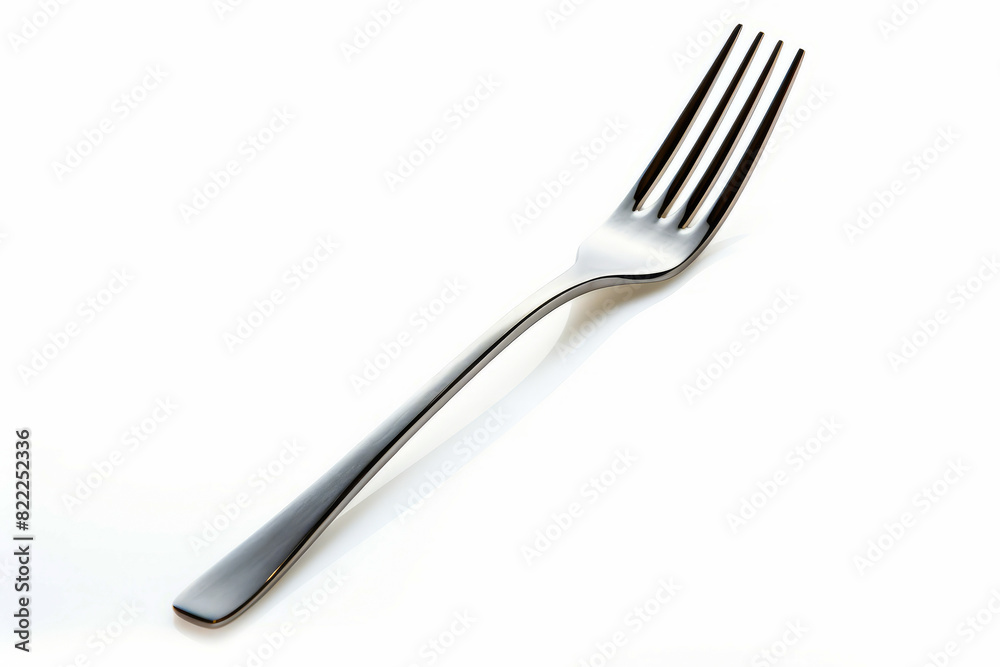 Fork with long handle on white surface with shadow. Fork with long handle on white surface with shadow.