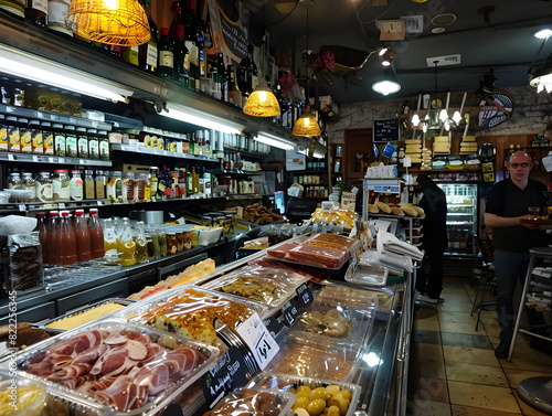 Vibrant Delicatessen Interior | Gourmet Food Store Shelves & Display Counters | Well-Stocked Array of Food Items & Beverages | of Gourmet Market Essentials photo