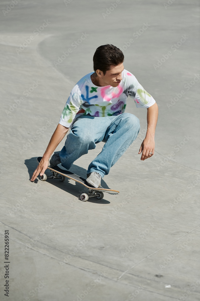 A young man executes tricks atop concrete on a skateboard at a sunny skate park. A young man executes tricks atop concrete on a skateboard at a sunny skate park.