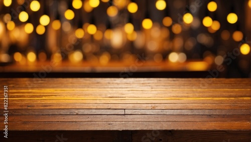 A wooden table is in the foreground with a blurry background of warm-colored lights.