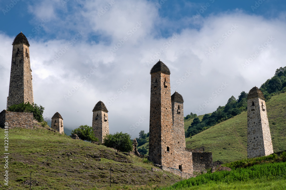 The Erzi tower complex. The ruins of an ancient city high in the mountains. Medieval battle towers built of stone to protect against attacks. Ingushetia. The North Caucasus. Russia