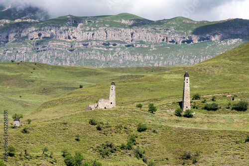 The Erzi tower complex. The ruins of an ancient city high in the mountains. Medieval battle towers built of stone to protect against attacks. Ingushetia. The North Caucasus. Russia photo