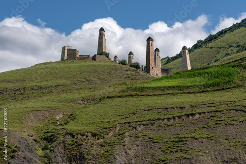 The Erzi tower complex. The ruins of an ancient city high in the mountains. Medieval battle towers built of stone to protect against attacks. Ingushetia. The North Caucasus. Russia photo