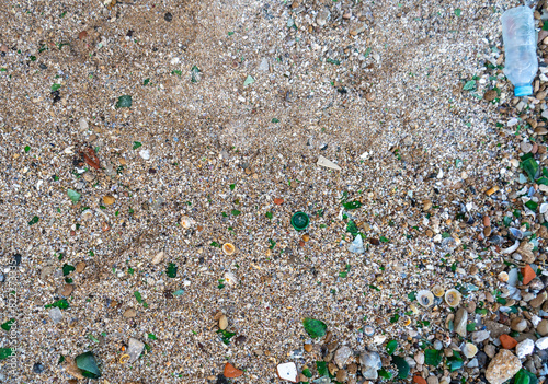 Microplastics on Sand Beach. Micro Plastics Garbage, Tiny Trash Pieces, Microplastic Waste, Dirty Shore