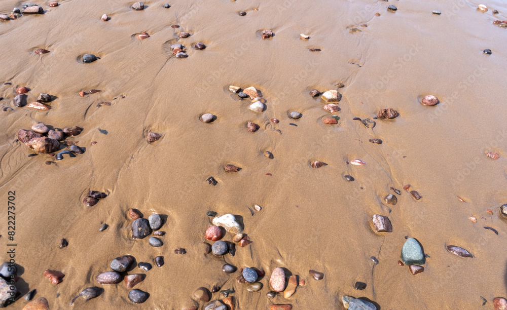Colored Pebble Beach Texture Background, Sand and Rocky Shore Pattern, Red Morocco Beach, Africa Colored Pebble Beach Texture Background, Sand and Rocky Shore Pattern, Red Morocco Beach, Africa