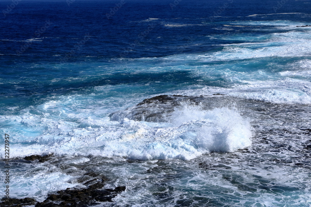 Stormy waves breaking on the stony beach in Fuerteventura in Jandia Natural Park Stormy waves breaking on the stony beach in Fuerteventura in Jandia Natural Park