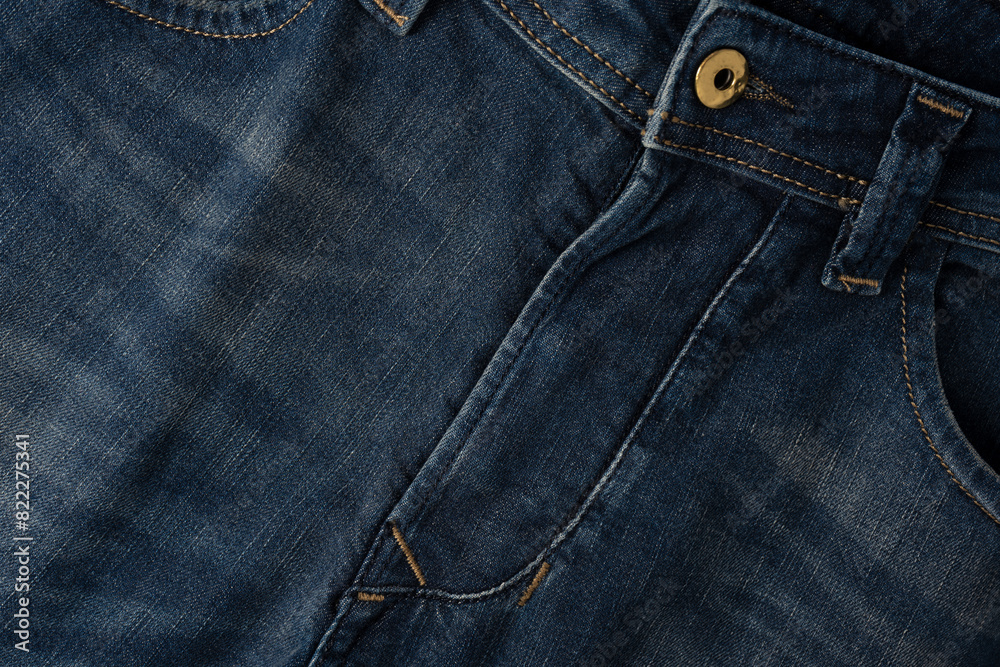Blue jeans denim texture as a background. Top view. Blue jeans denim texture as a background. Top view.