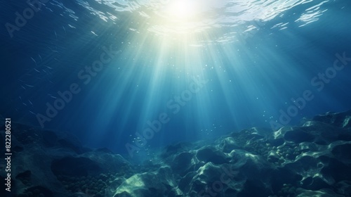 Calm underwater scene with sun rays reaching the seabed. Peaceful ocean background.