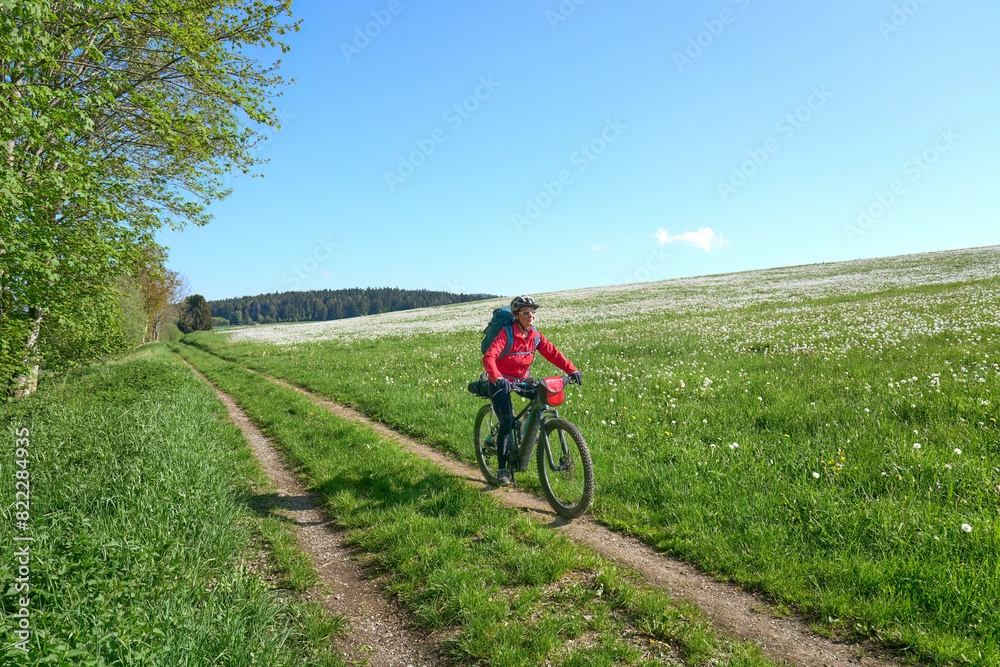 active senior woman on a bike packing tour with her electric mountain bike in the Bavarian Forest near Waldkirchen, Bavaria, Germany
active senior woman on a bike packing tour with her electric mountain bike in the Bavarian Forest near Waldkirchen, Bavaria, Germany